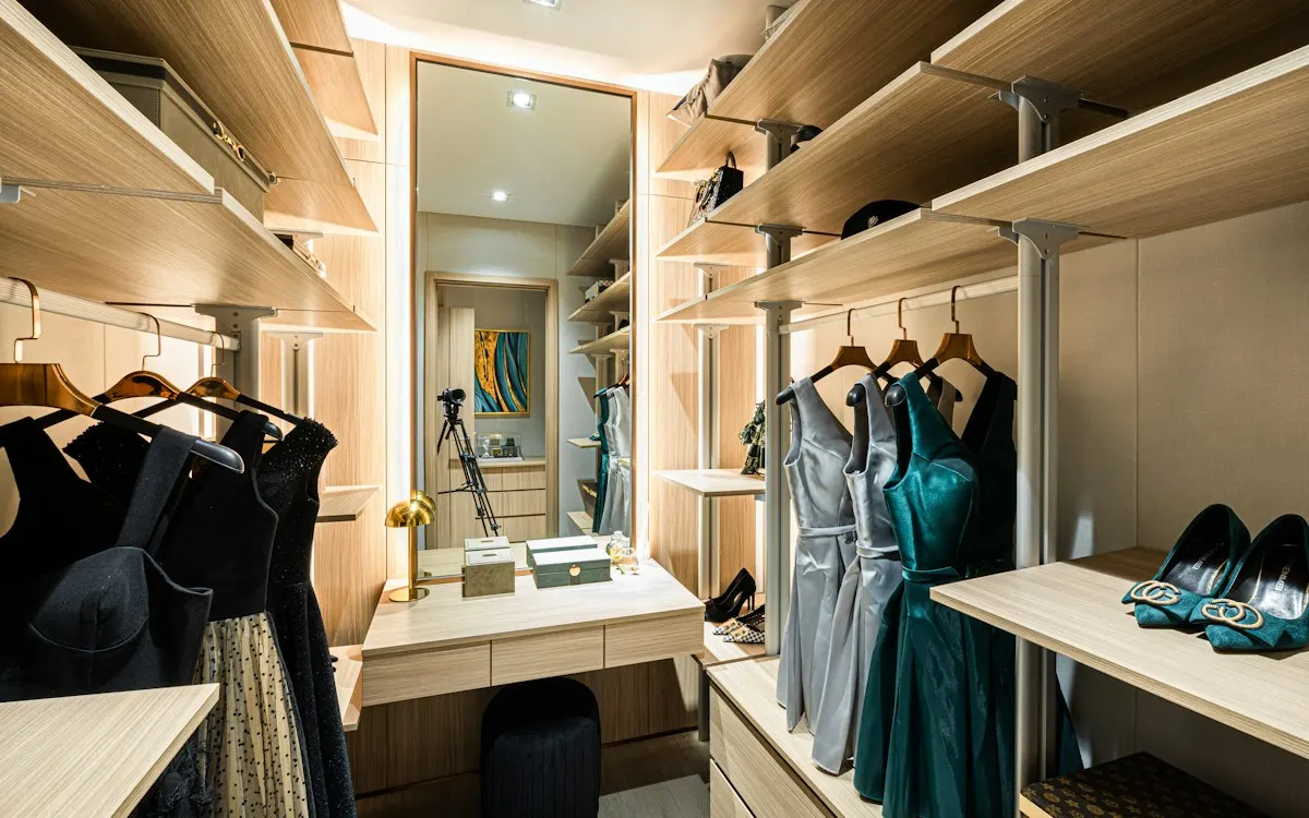 Walk-in wardrobe with shelves, hanging clothes and drawers